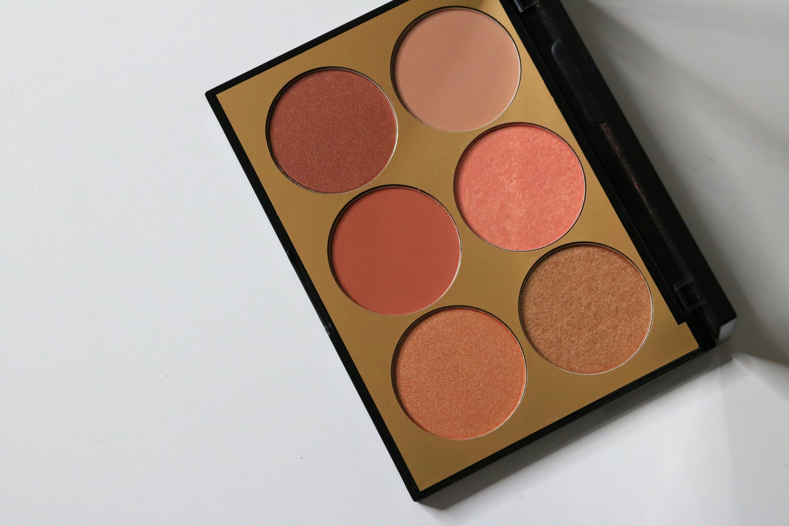 Affordable eyeshadow palette featuring shimmery browns and gold shades