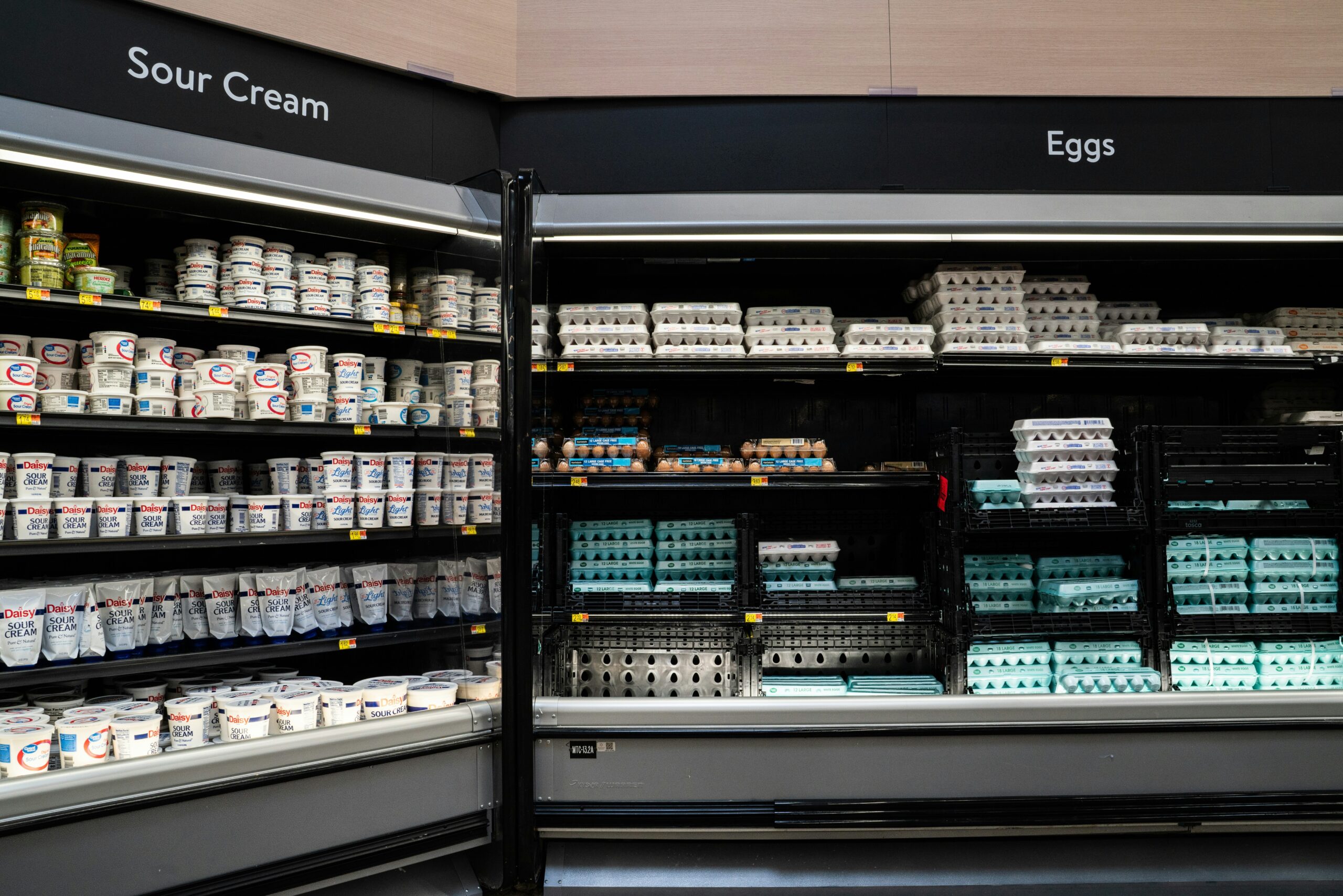 A colorful display of affordable drugstore makeup products on shelves.