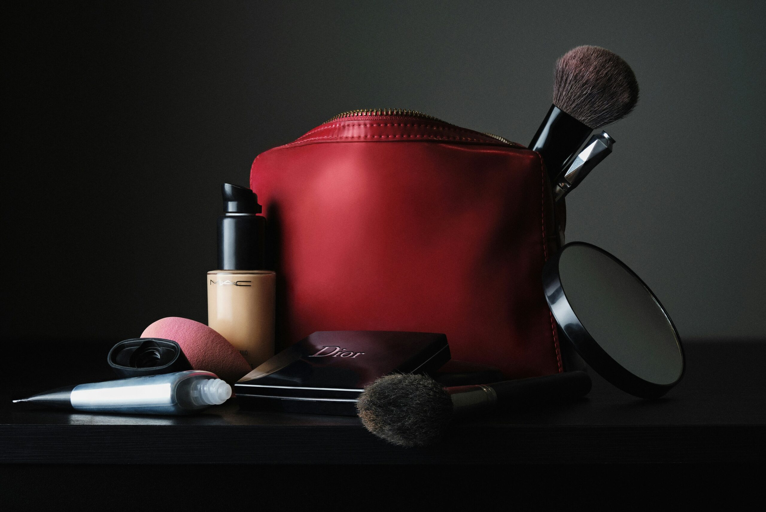 A stylish makeup bag filled with affordable drugstore products