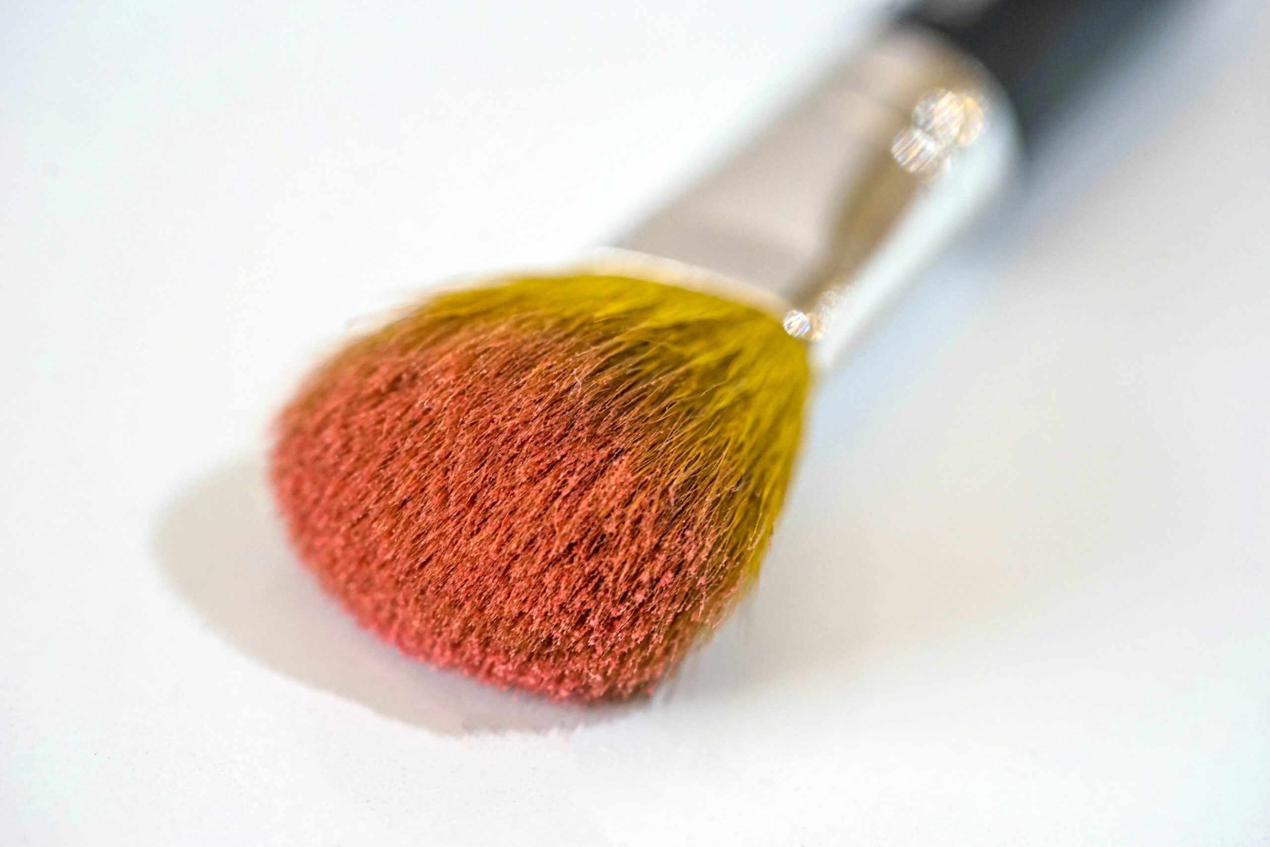Before-and-after photo showing improved makeup application with affordable brushes