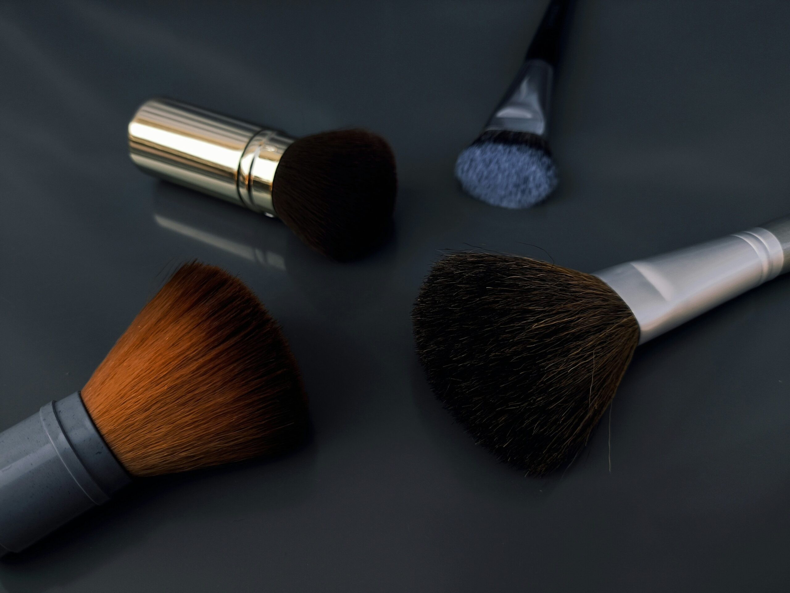 Side-by-side comparison of drugstore vs luxury makeup brushes