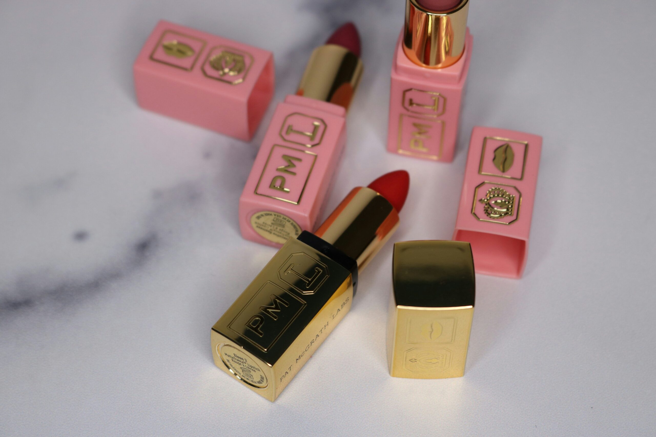 Three affordable nude lipsticks arranged neatly with tags showing prices.