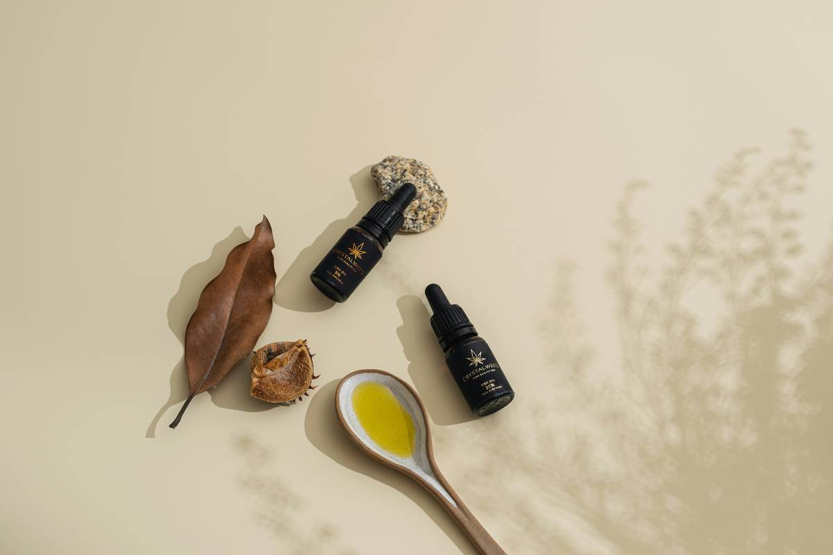 A woman applying tinted moisturizer with a brush