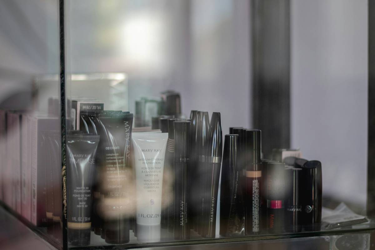 Side-by-side comparison of drugstore versus luxury makeup products.