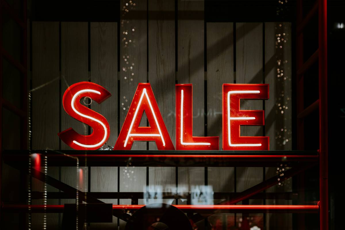 A drugstore display advertising buy-one-get-one-free mascara deals