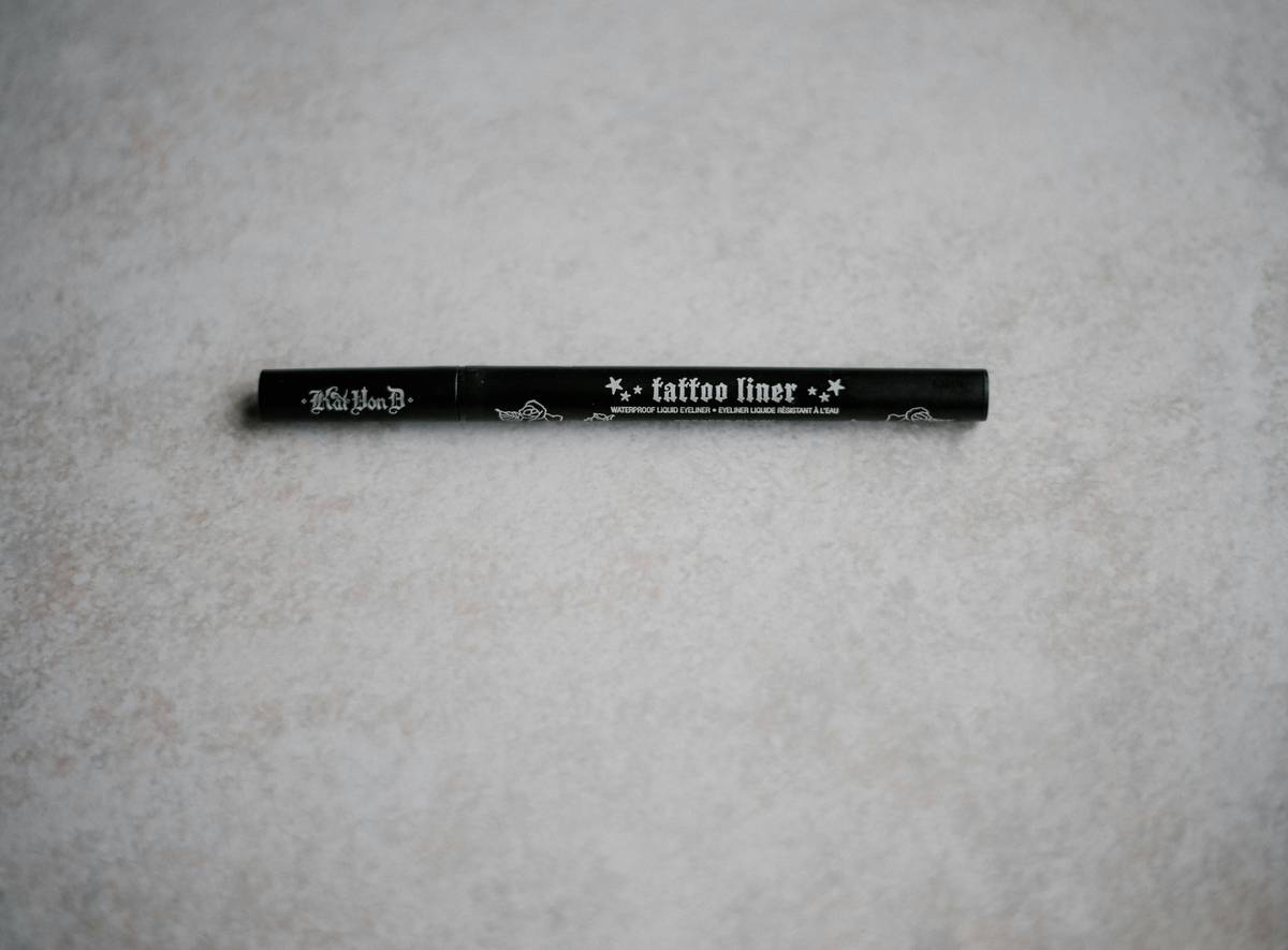 Two hands holding different types of economy eye pencils