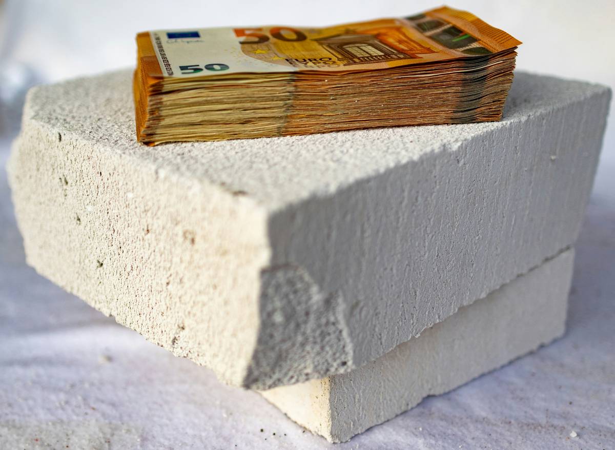 Woman holding two foundations at a drugstore